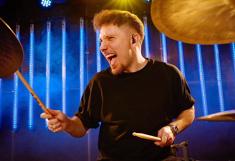DT 71 IE for Drummers and Bassists: In-ear monitor in ear of drummer on stage
